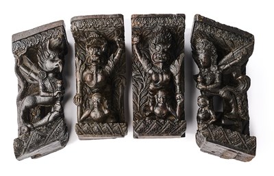 Lot 182 - FOUR CARVED WOOD FIGURES OF MYTHICAL DEITIES, NEPAL, 19TH CENTURY