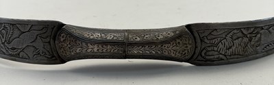 Lot 28 - A NORTH INDIAN DECORATED STEEL BOW, 19TH CENTURY