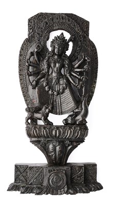 Lot 180 - A CARVED WOOD FIGURE OF DURGA SLAYING THE BUFFALO DEMON, NEPAL, 19TH CENTURY