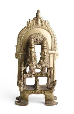 Lot 214 - A FOLK BRONZE SHRINE DEPICTING SIVA AND PARVATI, CENTRAL INDIA, 18TH/19TH CENTURY