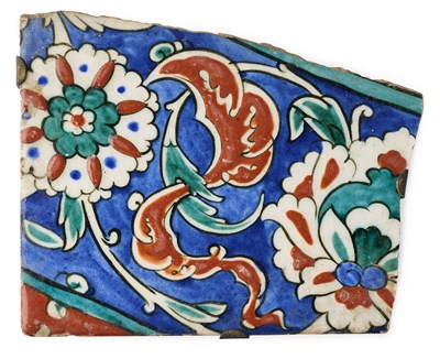 Lot 128 - AN IZNIK TILE FRAGMENT, OTTOMAN ANATOLIA, CIRCA 1570