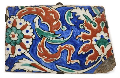 Lot 127 - AN IZNIK TILE FRAGMENT, OTTOMAN ANATOLIA, CIRCA 1570