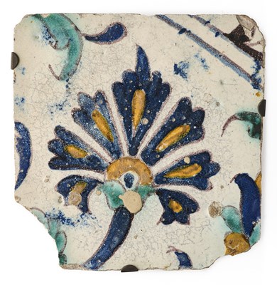 Lot 121 - A CUERDA SECA TILE DEPICTING A CARNATION, TUNISIA, 18TH CENTURY