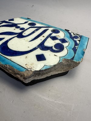 Lot 123 - A DAMASCUS CALLIGRAPHIC TILE FRAGMENT, OTTOMAN SYRIA, 1560-1570