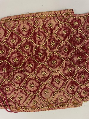 Lot 8 - A PADDED VELVET ARM GUARD, RAJASTHAN OR DECCAN, 18TH CENTURY