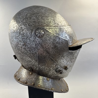 Lot 230 - A NORTH ITALIAN CLOSE HELMET, FIRST QUARTER OF THE 17TH CENTURY