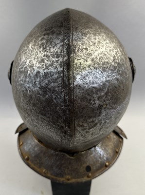 Lot 230 - A NORTH ITALIAN CLOSE HELMET, FIRST QUARTER OF THE 17TH CENTURY