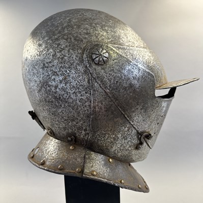 Lot 230 - A NORTH ITALIAN CLOSE HELMET, FIRST QUARTER OF THE 17TH CENTURY