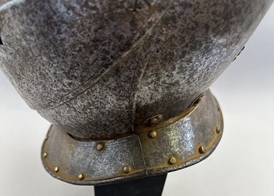 Lot 230 - A NORTH ITALIAN CLOSE HELMET, FIRST QUARTER OF THE 17TH CENTURY