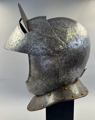 Lot 230 - A NORTH ITALIAN CLOSE HELMET, FIRST QUARTER OF THE 17TH CENTURY