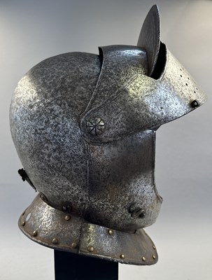 Lot 230 - A NORTH ITALIAN CLOSE HELMET, FIRST QUARTER OF THE 17TH CENTURY
