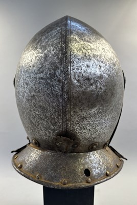 Lot 230 - A NORTH ITALIAN CLOSE HELMET, FIRST QUARTER OF THE 17TH CENTURY