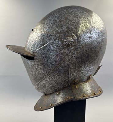Lot 230 - A NORTH ITALIAN CLOSE HELMET, FIRST QUARTER OF THE 17TH CENTURY