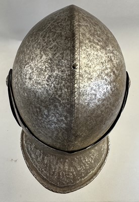 Lot 230 - A NORTH ITALIAN CLOSE HELMET, FIRST QUARTER OF THE 17TH CENTURY