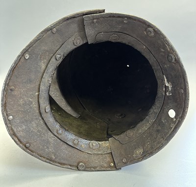 Lot 230 - A NORTH ITALIAN CLOSE HELMET, FIRST QUARTER OF THE 17TH CENTURY