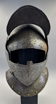 Lot 230 - A NORTH ITALIAN CLOSE HELMET, FIRST QUARTER OF THE 17TH CENTURY