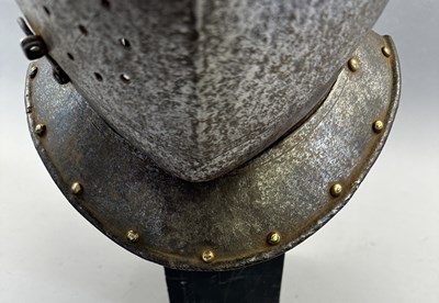 Lot 230 - A NORTH ITALIAN CLOSE HELMET, FIRST QUARTER OF THE 17TH CENTURY