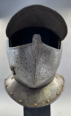 Lot 230 - A NORTH ITALIAN CLOSE HELMET, FIRST QUARTER OF THE 17TH CENTURY