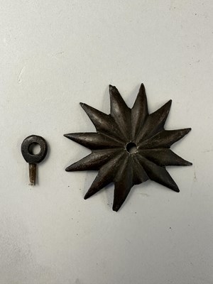 Lot 181 - A RARE ZISCHÄGGE OF SIEGE WEIGHT, MID-17TH CENTURY, SOUTH GERMAN OR EAST EUROPEAN