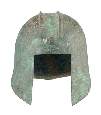 Lot 258 - A GREEK BRONZE HELMET OF ILLYRIAN TYPE, 6TH-5TH CENTURY B.C.