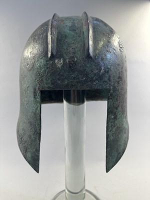 Lot 258 - A GREEK BRONZE HELMET OF ILLYRIAN TYPE, 6TH-5TH CENTURY B.C.
