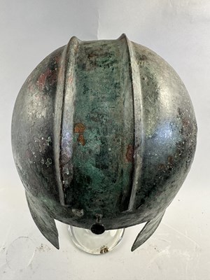 Lot 258 - A GREEK BRONZE HELMET OF ILLYRIAN TYPE, 6TH-5TH CENTURY B.C.