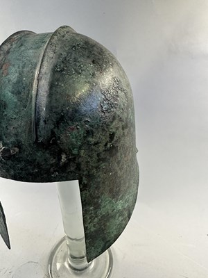 Lot 258 - A GREEK BRONZE HELMET OF ILLYRIAN TYPE, 6TH-5TH CENTURY B.C.