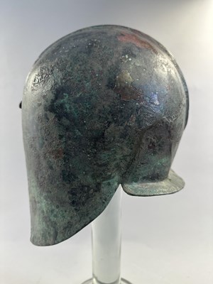 Lot 258 - A GREEK BRONZE HELMET OF ILLYRIAN TYPE, 6TH-5TH CENTURY B.C.