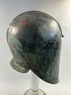 Lot 258 - A GREEK BRONZE HELMET OF ILLYRIAN TYPE, 6TH-5TH CENTURY B.C.