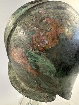 Lot 258 - A GREEK BRONZE HELMET OF ILLYRIAN TYPE, 6TH-5TH CENTURY B.C.