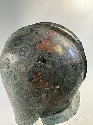 Lot 258 - A GREEK BRONZE HELMET OF ILLYRIAN TYPE, 6TH-5TH CENTURY B.C.