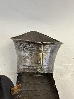 Lot 170 - A COMPOSITE NORTH ITALIAN CAP-A-PIE ARMOUR WITH ETCHED DECORATION, LATE 16TH CENTURY, THE BACKPLATE SIGNED BY THE MASTER ‘P’