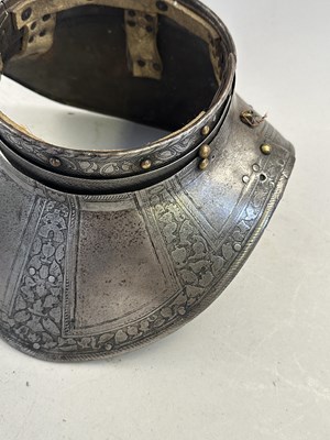 Lot 170 - A COMPOSITE NORTH ITALIAN CAP-A-PIE ARMOUR WITH ETCHED DECORATION, LATE 16TH CENTURY, THE BACKPLATE SIGNED BY THE MASTER ‘P’