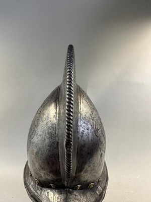 Lot 170 - A COMPOSITE NORTH ITALIAN CAP-A-PIE ARMOUR WITH ETCHED DECORATION, LATE 16TH CENTURY, THE BACKPLATE SIGNED BY THE MASTER ‘P’