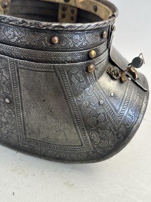 Lot 170 - A COMPOSITE NORTH ITALIAN CAP-A-PIE ARMOUR WITH ETCHED DECORATION, LATE 16TH CENTURY, THE BACKPLATE SIGNED BY THE MASTER ‘P’