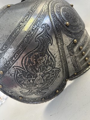Lot 170 - A COMPOSITE NORTH ITALIAN CAP-A-PIE ARMOUR WITH ETCHED DECORATION, LATE 16TH CENTURY, THE BACKPLATE SIGNED BY THE MASTER ‘P’