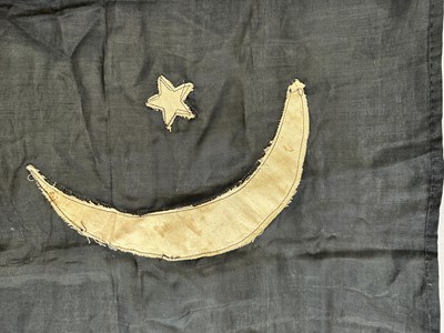 Lot 597 - □ A FLAG OR BANNER OF THE EMIRATE OF CYRENAICA (LIBYA), CIRCA 1949-51