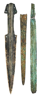 Lot 413 - A COPPER ALLOY DAGGER AND TWO BLADES, PROBABLY 1300-800 B.C.