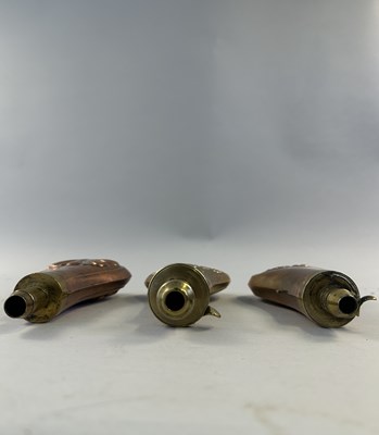 Lot 612 - □ THREE COPPER ALLOY POWDER-FLASKS, 19TH CENTURY AND LATER