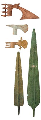 Lot 502A - A COPPER ALLOY SPEARHEAD, POSSIBLY LURISTAN CIRCA 1300-900 B.C., ANOTHER, LATER, AND THREE AXE HEADS, IN LURISTAN BRONZE AGE STYLE, 20TH CENTURY