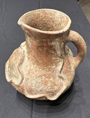 Lot 79 - □ AN ANCIENT PERSIAN TERRACOTTA EWER