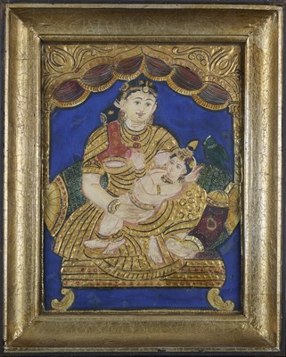 Lot 216 - A TANJORE PAINTING OF YASHODA AND KRISHNA, TAMIL NADU, CIRCA 1900