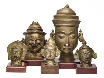 Lot 174 - FIVE BRONZE SIVA MASKS, DECCAN, INDIA, 19TH CENTURY