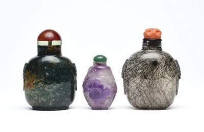 Lot 87 - THREE CHINESE CARVED HARDSTONE SNUFF BOTTLES