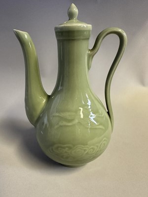 Lot 7 - A CHINESE CELADON-GLAZED EWER AND COVER