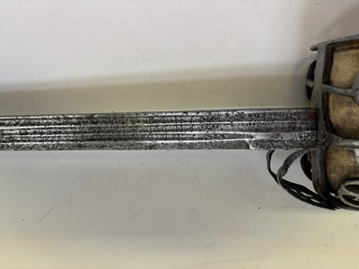 Lot 125 - A HIGHLAND BASKET-HILTED BACKSWORD, SECOND HALF OF THE 18TH CENTURY