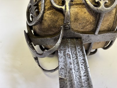 Lot 125 - A HIGHLAND BASKET-HILTED BACKSWORD, SECOND HALF OF THE 18TH CENTURY