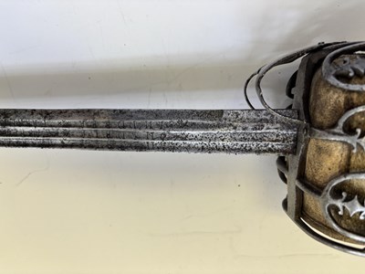 Lot 125 - A HIGHLAND BASKET-HILTED BACKSWORD, SECOND HALF OF THE 18TH CENTURY