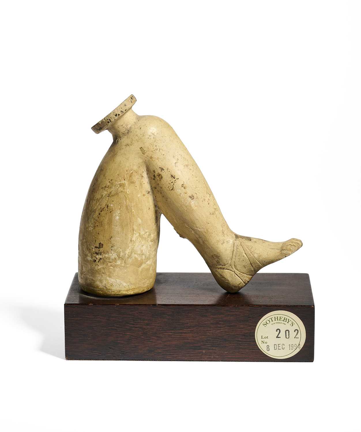 Lot 16 - A CORINTHIAN POTTERY  'PLASTIC' VASE IN THE FORM OF A HUMAN LEG, CIRCA 6TH CENTURY B.C.