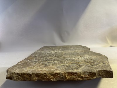 Lot 19 - A CHINESE CARVED GREY STONE PANEL FRAGMENT